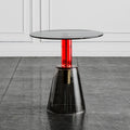 Modern glass table with a red central column on a gray floor, Obroi