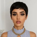 Woman with short black hair wearing a gold necklace against a white background, Obroi