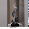 Obroi decorative glass sculpture on a stand with text in the background