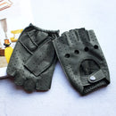 Pair of black leather gloves with fingerless design on a light surface, Obroi
