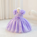Lavender dress with floral details on a mannequin against a white background, Obroi