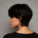 Woman with a stylish short black haircut against a gray background, Obroi
