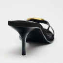 Black high-heeled shoe on a white background, Obroi