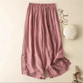 Pink pants on a beige background with a white shell and beige shoes, Obroi