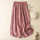 Pink pants on a beige background with a white shell and beige shoes, Obroi