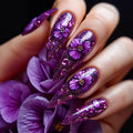 Nails with purple floral design on a dark background, Obroi