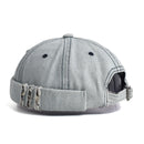 Gray denim cap with worn edges on a white background, Obroi