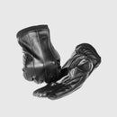 Pair of black leather gloves on a light gray background, Obroi