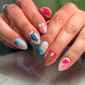 Close-up of hands with colorful nail art featuring flowers, leaves, and sea creatures, Obroi
