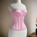 Pink corset on a mannequin against a neutral background, Obroi