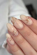 Nails with star-shaped decorations on a neutral background, Obroi