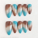 Set of gradient nail art tips with blue, brown, and white colors on a white background, Obroi