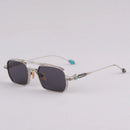 Sunglasses with a clear frame and dark lenses on a light gray background, Obroi