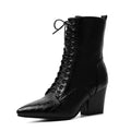 Black lace-up boot with a block heel on a white background, Obroi