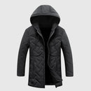 Black quilted jacket with a hood on a light gray background, Obroi