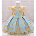 Light blue dress with gold embroidery on a mannequin against a white background, Obroi