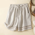 Light gray shorts with lace trim on a beige background, Obroi