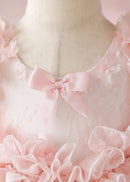 Close-up of a pink dress with floral details on a mannequin, Obroi