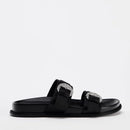 Black sandals with silver buckles on a white background, Obroi