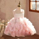 Pink floral dress on a mannequin with a blurred indoor background, Obroi