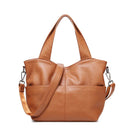 Brown leather handbag with a shoulder strap on a white background, Obroi