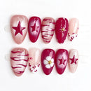 Set of handmade nails with various designs including stars and flowers on a white background, Obroi