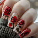 Nails with red rose design on a textured surface, Obroi