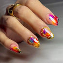 Hand with colorful nail art and a gold ring on a neutral background, Obroi