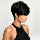 A woman shown in profile wearing a short, layered black wig with textured, voluminous styling against a plain light gray background, Obroi