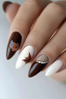 Nails with brown and white design featuring leaf patterns on a neutral background, Obroi