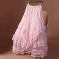 Pink ruffled skirt on a hanger against a brown background, Obroi