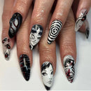 Obroi Nails with artistic black, white, and red designs on a white background