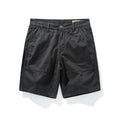 Black shorts on a white background with a visible brand label, Obroi