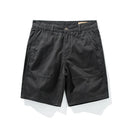 Black shorts on a white background with a visible brand label, Obroi