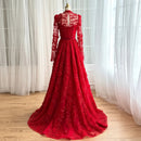 Red lace evening gown on a mannequin against a white curtain background, Obroi
