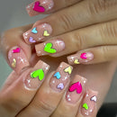 Nails with colorful heart designs on a clear background, Obroi