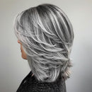Person with styled silver hair in a salon setting, Obroi
