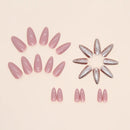 Set of pink and silver nail extensions arranged in a circular pattern on a beige background, Obroi