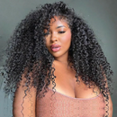 Woman with voluminous curly hair wearing a pink top against a gray background, Obroi