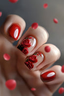 Close-up of a hand with red rose nail art on a neutral background, Obroi