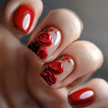 Close-up of a hand with red rose nail art on a neutral background, Obroi