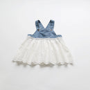 Denim pinafore dress with lace skirt on a white background, Obroi