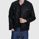 Person wearing a black leather jacket and blue jeans on a white background, Obroi