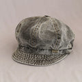 Vintage-style cap with plaid brim on a beige background, Obroi