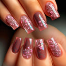 Nails with floral design and pink polish on a neutral background, Obroi