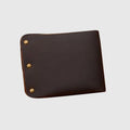 Brown leather wallet with gold rivets on a light gray background, Obroi
