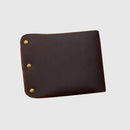 Brown leather wallet with gold rivets on a light gray background, Obroi
