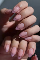 Close-up of hands with pink and gold nail polish, Obroi