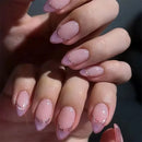 Close-up of hands with pink and gold nail polish, Obroi