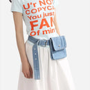 Person wearing a white t-shirt with red text, light-colored pants, and a denim bag on a white background, Obroi